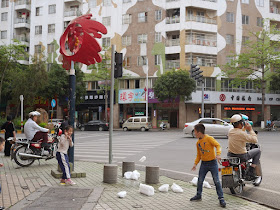 kids throwing chunks of ice in Yunfu, Guangdong