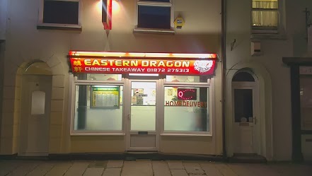 Front image of our shop at night