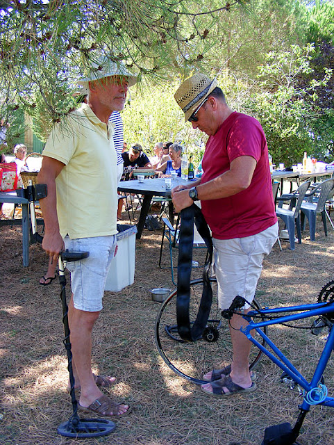Fixing a bike tyre puncture. Indre et Loire, France. Photographed by Susan Walter. Tour the Loire Valley with a classic car and a private guide.