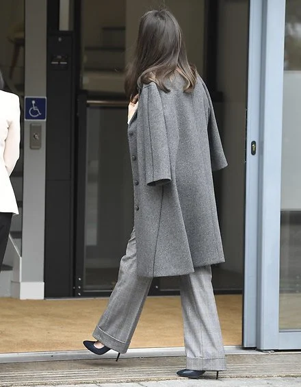 Grey swing coat from Nina Ricci, and bibosa silk bow blouse from Hugo Boss. Massimo Dutti Prince of Wales print trousers
