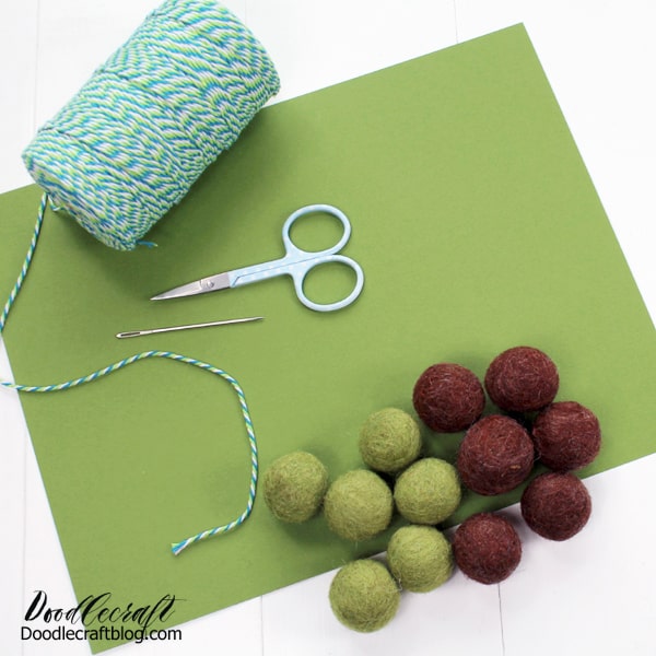 Supplies needed for Baby Yoda Felt Ball bunting: green cardstock, brown and green felted balls, bakers twine, darning needle, scissors and hot glue/gun