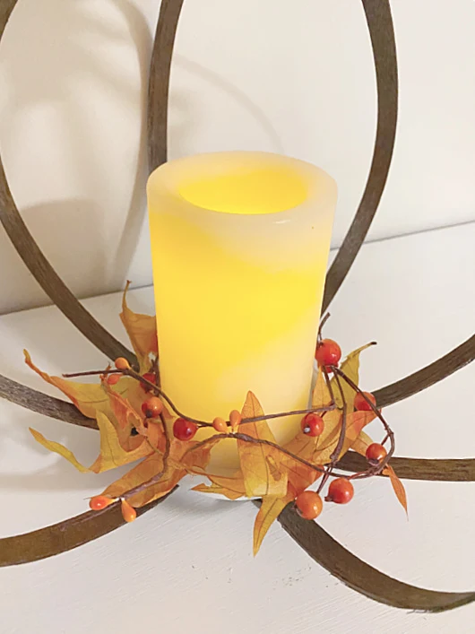 flameless candle with fall foliage