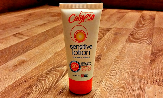 The tube of Calypso Sensitive Face and Neck Lotion on a wooden floor