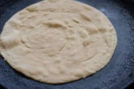 cook-paratha-on-hot-skillet