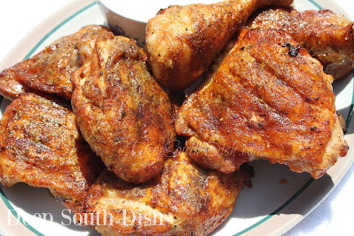 Chicken thighs and legs, rub marinated, then smoke cooked, brushed with Alabama white sauce and served with additional sauce on the side. May also be grilled or baked.