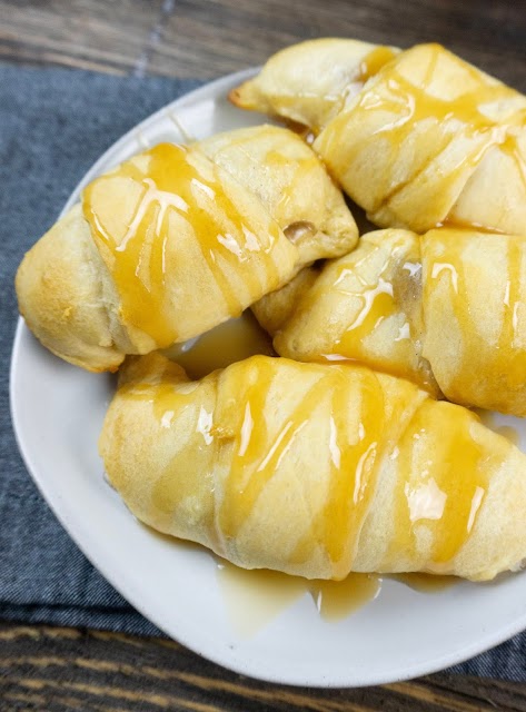 Croissants on a plate with blue and brown background.