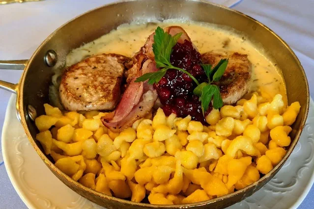 What to do in Innsbruck: eat pork medallions with mushroom sauce, buttered spatzle and cranberry