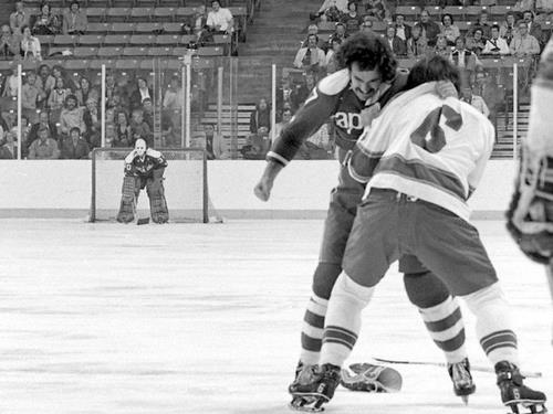 ...And makes sure it doesn't get knocked off during a 2nd period fight with Larry Johnston
