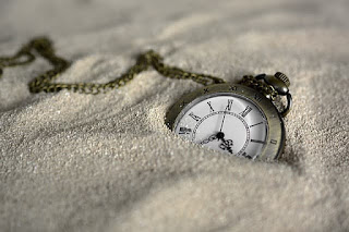 pocket watch in the sand