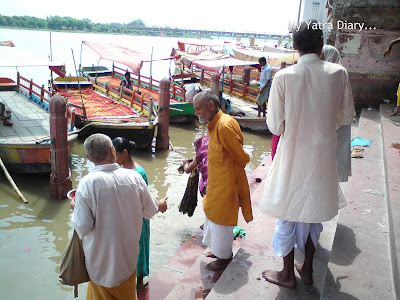 Pilgrims praying at the Yamuna River Ghat, Mathura