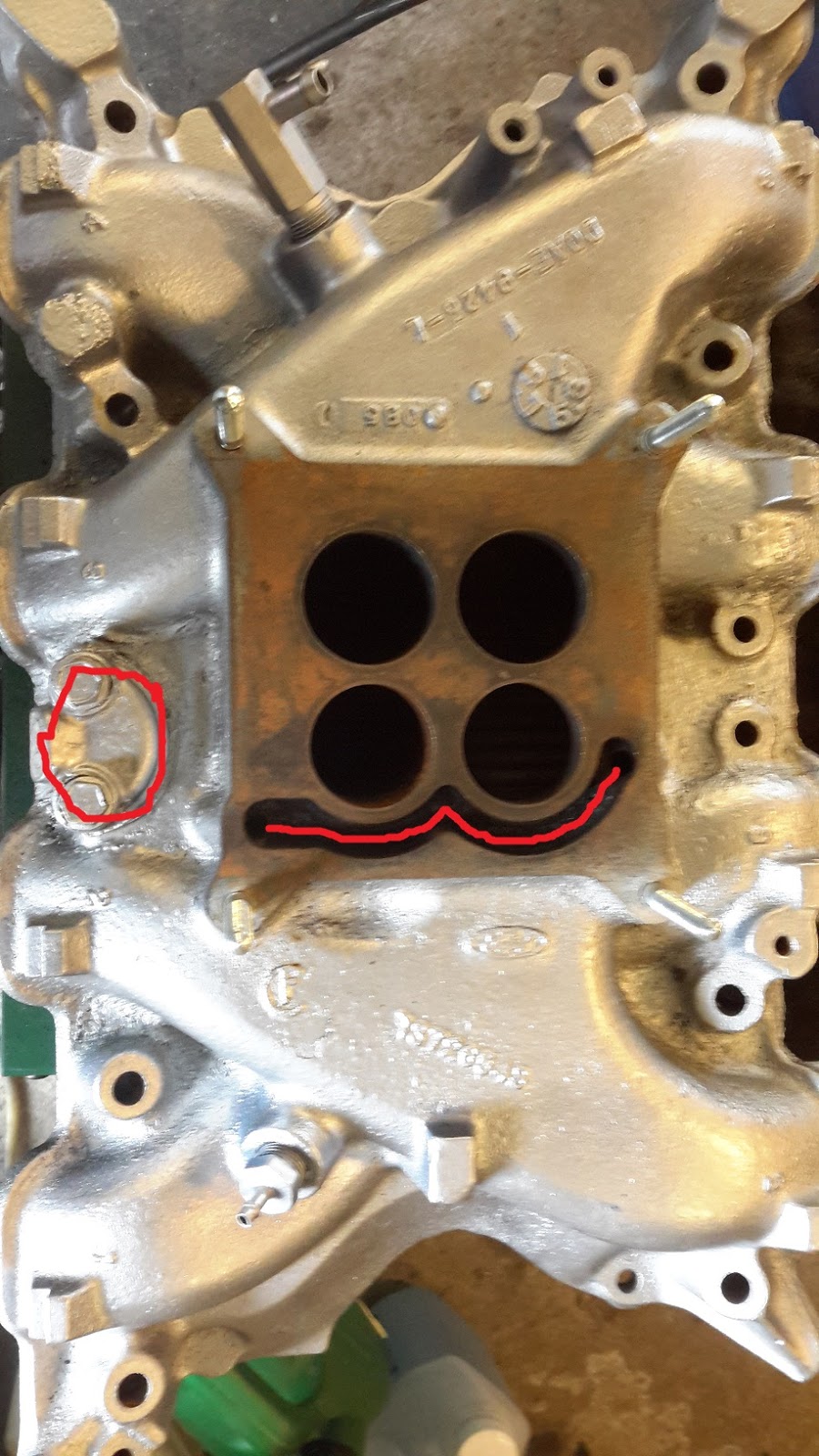 Kvicksilverpuman Heat riser delete, exhaust port block off.