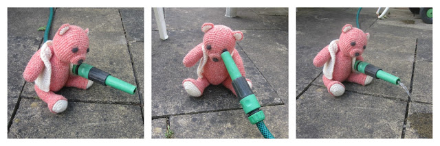 Fiddly Fingers crochet bear Taffy holding hosepipe watering patio