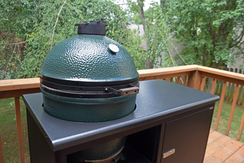 Large Big Green Egg kamado grill in a Challenger Designs Torch 48