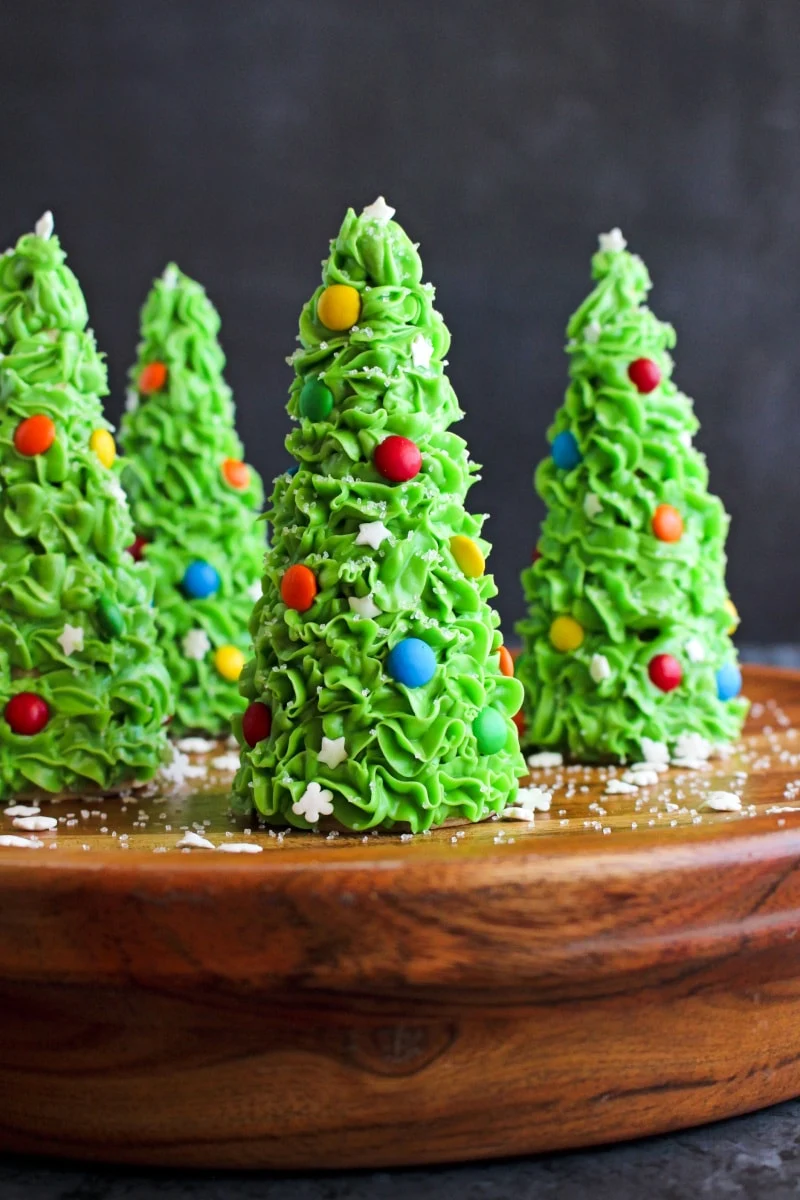 Ice Cream Cone Christmas Trees on a wooden stand with a dark grey background.