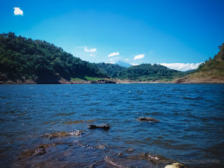 Natural Lake Water Of Titab Ularan Dam Between The Hills On A Sunny Day In The Dry Season North Bali Indonesia