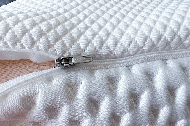 close up of the side of the TEMPUR® pillow showing the padded cover and zip