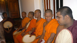 A set of buddhist monks receiving alms giving