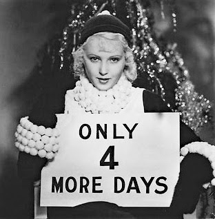 June Lang holding Christmas countdown sign