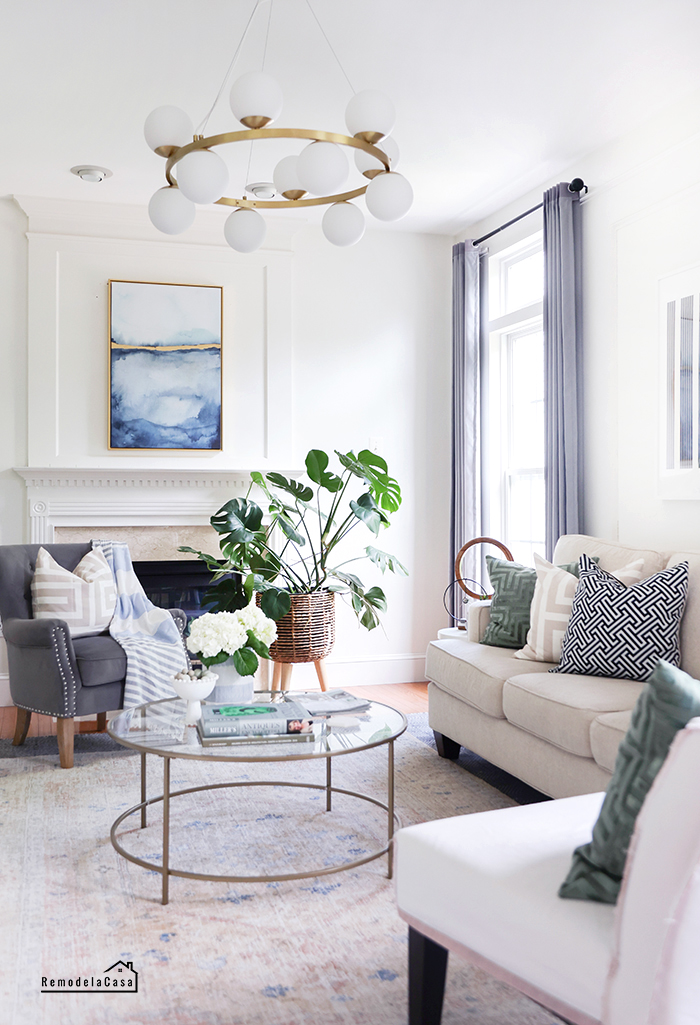 family room with bubbles brass ring pendant light from CB2