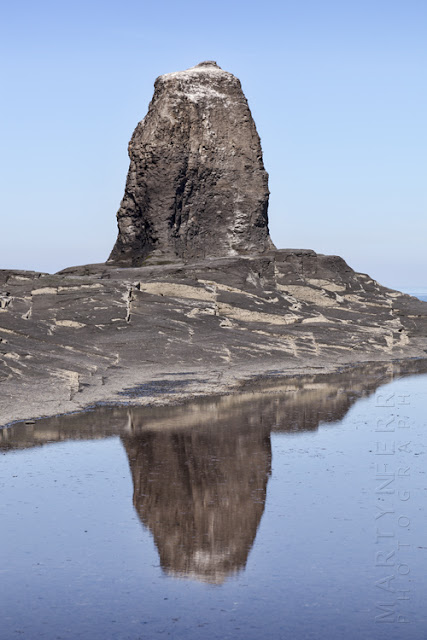 Reflection of Black Nab at Saltwick Bay in Whitby by Martyn Ferry Photography