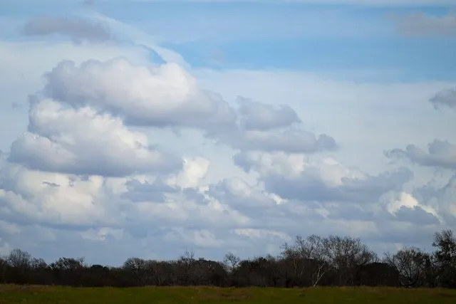 Puffy clouds in a big Texas sky between Austin and Houston