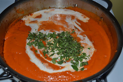 Stir in heavy cream to tomato sauce to make pink vodka sauce. Add fresh oregano.