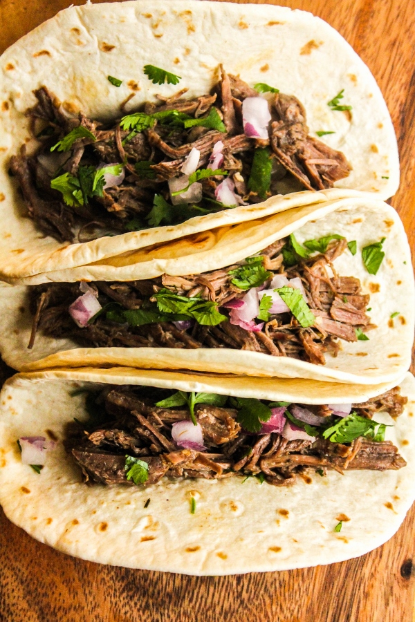 This Pressure Cooker Beef Carnitas Tacos recipe is juicy, flavorful and delicious, and so quick and easy to make!