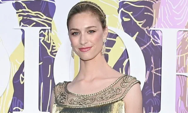 Beatrice Borromeo wore a golden fringed gown and headpiece from Christian Dior. Buccellati Milan earrings and bracelet