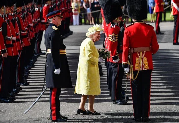 The traditional 'Ceremony of the Keys' took place tonight at Holyroodhouse in Edinburgh. yellow dress, jcoat and hat