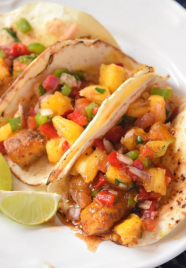 easy fish taco recipe with best fish taco sauce and pineapple salsa
