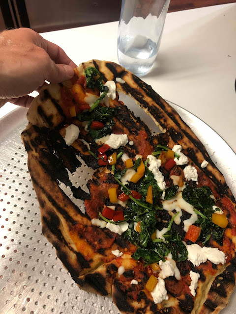 grilled pizza with burn holes
