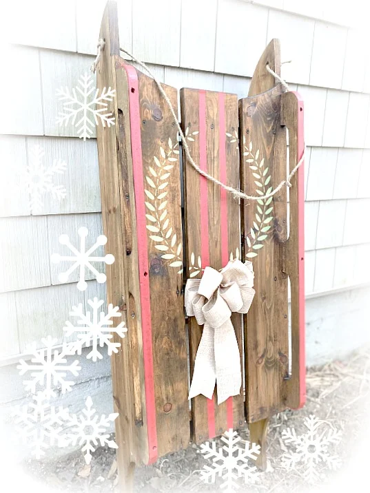 wooden sled with a wreath and stripes