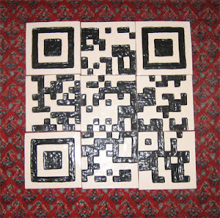 These clay tiles are shown assembled in the correct sequence to be read by a QR Code scanner.