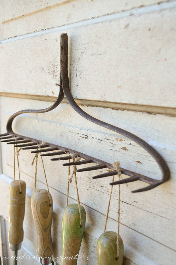 Garden Tool Organizer made from a repurposed metal rake head....a convienent and decorative way to store tools |  www.andersonandgrant.com