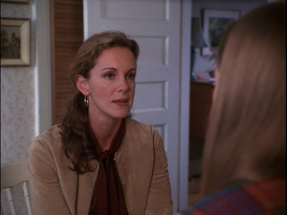 Elizabeth Perkins as Frances. 