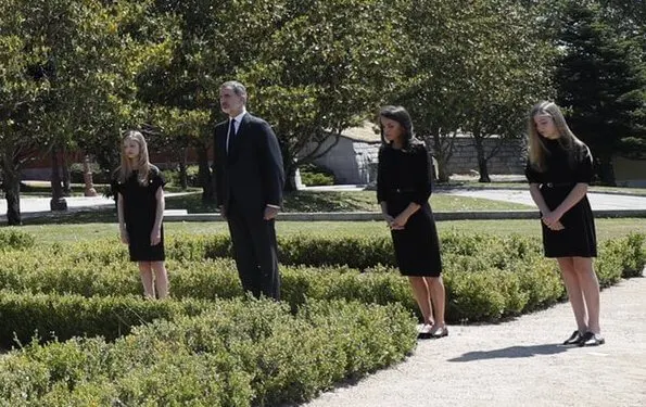 King Felipe, Queen Letizia, Princess Leonor and Infanta Sofia observed a minute's silence for victims of the coronavirus. Felipe Varela dress