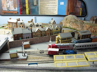 Detail of a model railway layout inside an old Bedford van.