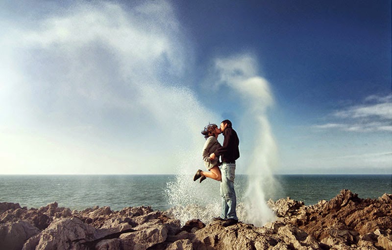 Romantic Couple Kissing near Sea Tide