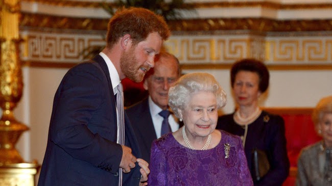 Britain's Prince Harry and Queen Elizabeth look at the Webb Ellis Cup on a plinth during a Rugby World Cup reception at Buckingham Palace, London October 12, 2015. Britain's Prince Harry and Queen Elizabeth look at the Webb Ellis Cup on a plinth during a Rugby World Cup reception at Buckingham Palace, London October 12, 2015.
