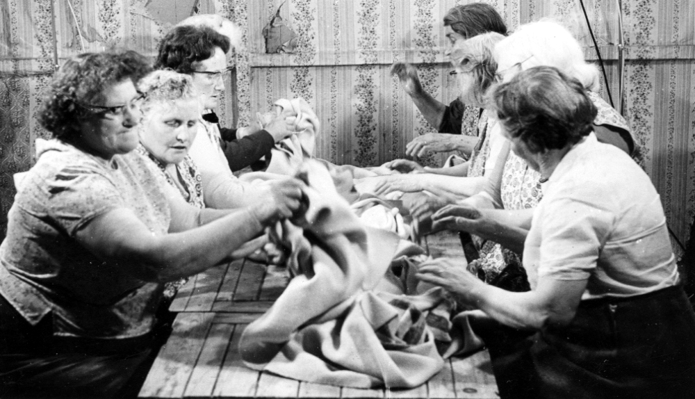 Pictures of Scotswomen Singing at a Table While Waulking the Cloth From