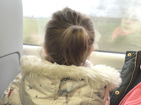 my toddler looking out the train window