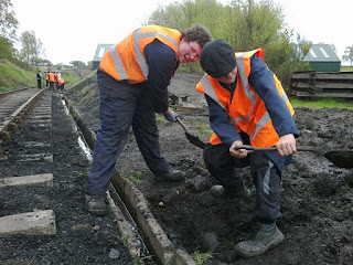 Kyle and Callum clearing out the drainage channel