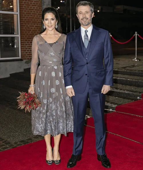 Crown Princess Mary wore a new bespoke silk chiffon and metallic embroidery dress from Soeren Le Schmidt, and aquamarine girandole earrings