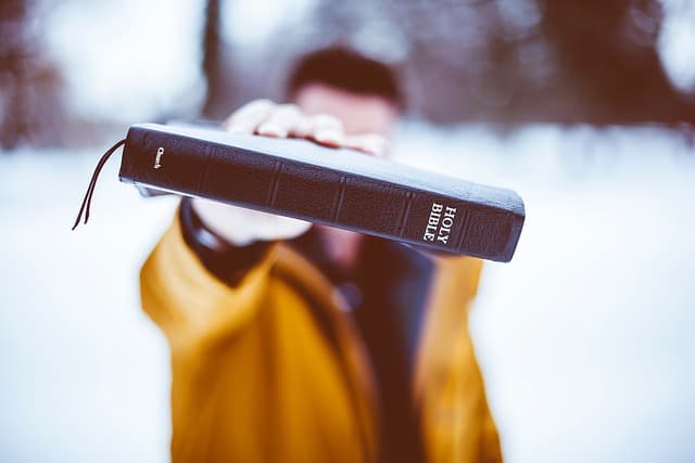 holding a bible