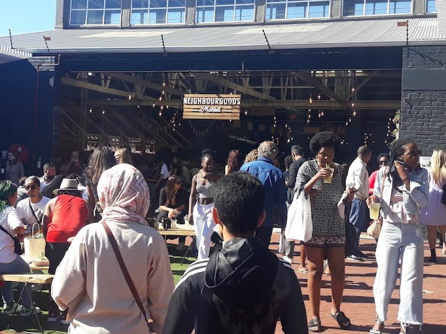 People shop at the crowded Neighbourgoods Market in Cape Town