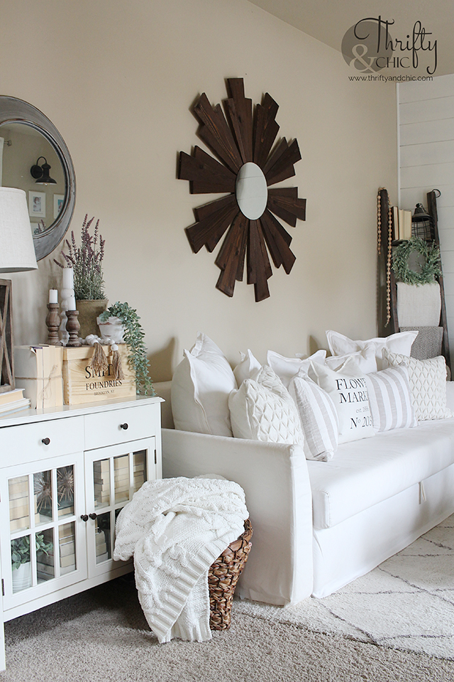 Spring living room decor and decorating ideas. Neutral farmhouse decor. White and wood living room. Faux fireplace decorating ideas. Spring mantel decor. Spring mantle decor. How to decorate for spring. Spring decorating tips. 