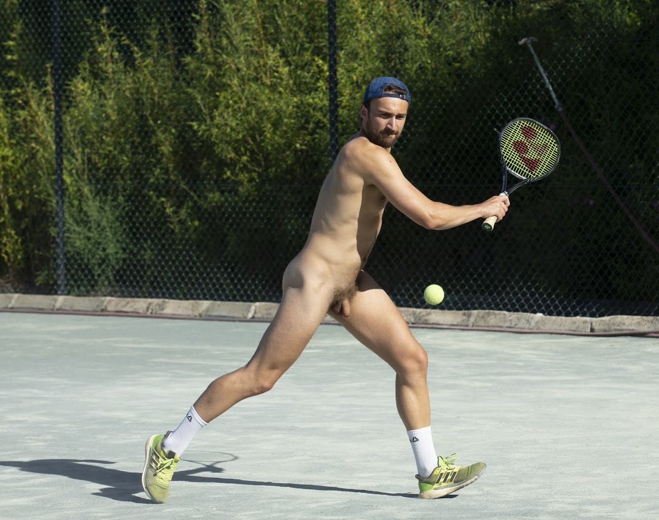 Nude male tennis player