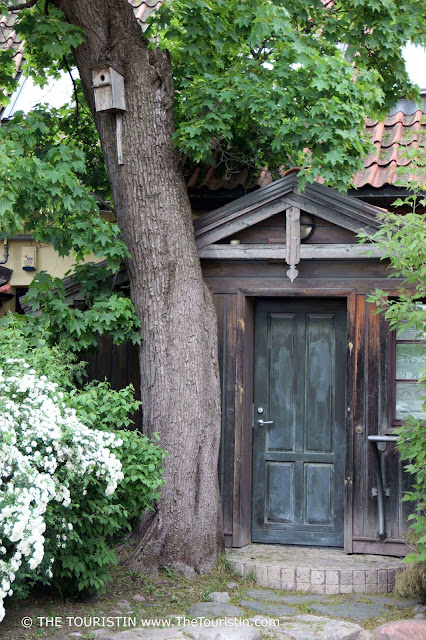 The romantic entrance door of a Wooden House in Užupis in Lithuania The Touristin