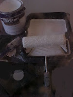 Paint can, Paint tray and roller ready to paint the walls