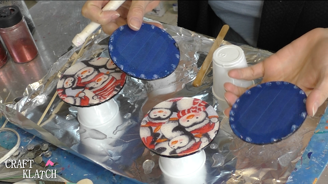 Learn how to make penguin fabric coasters! It's a great Christmas craft idea and beautiful home decor for the holidays! #craftklatch #craftideas #christmas #christmascraftideas #crafts #christmascrafts #howto #diy #penguins #resin #resincrafts #resincoasters #resindiys